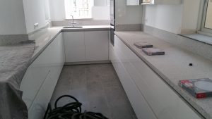 Builders installing a new kitchen in Malaga